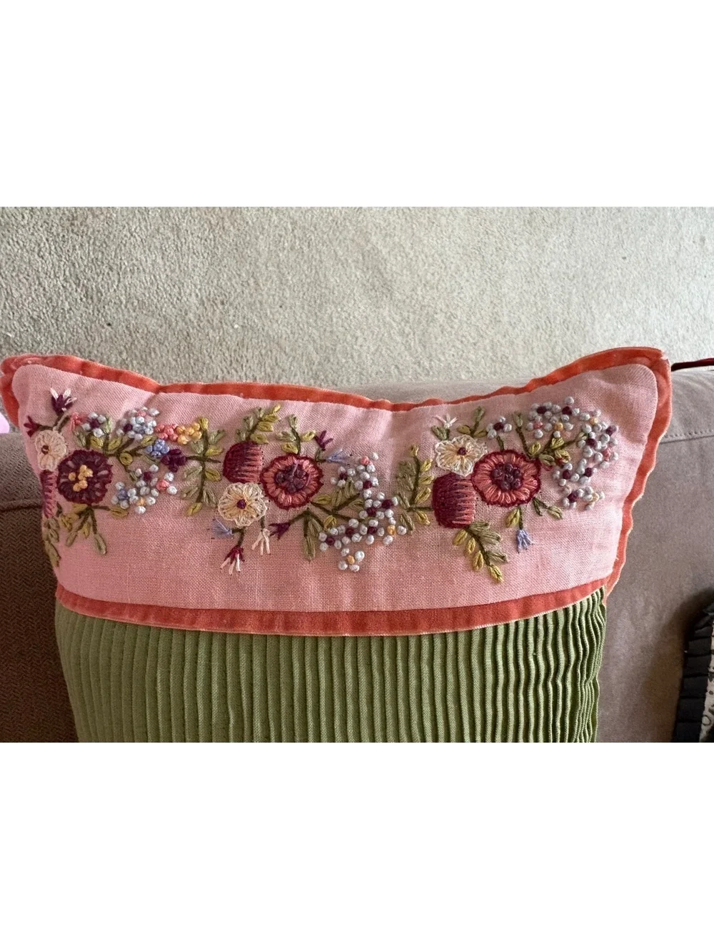 Two beautifully embroidered decorative lumbar pillows.